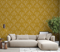 Living room styled with mustard gold folk floral wallpaper and soft neutral sofa