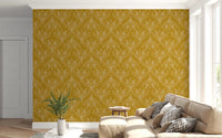 Cozy living area enhanced by mustard gold botanical wallpaper and warm textures