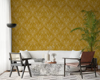 Stylish interior corner with mustard gold floral wallpaper and wooden furniture