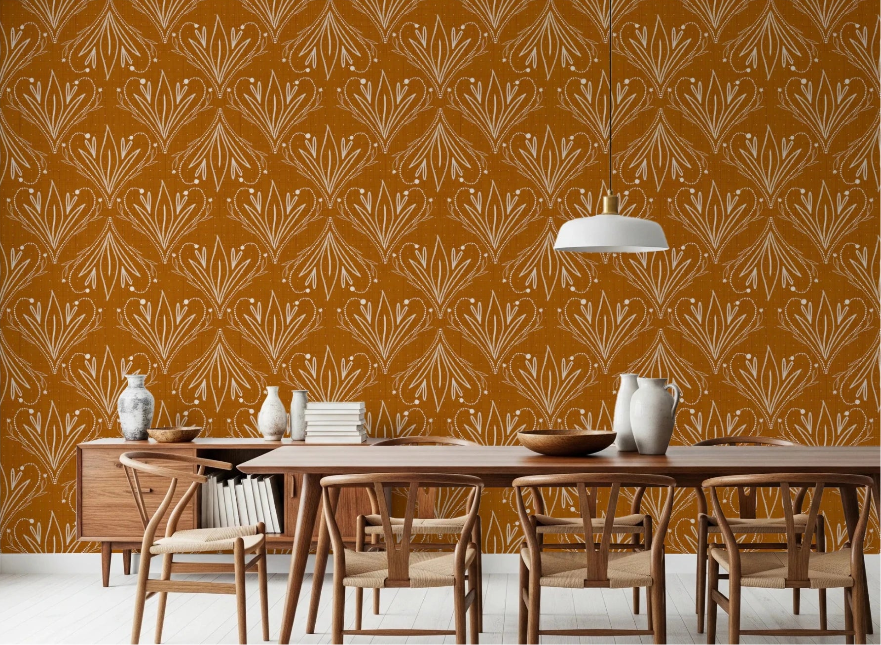 Dining room styled with mustard gold folk floral wallpaper and wooden furniture