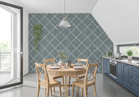 Kitchen dining zone finished in calming blue dotted trellis wallpaper with light accents
