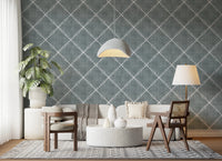 Living room space softened by calming blue trellis wallpaper with subtle dotted pattern
