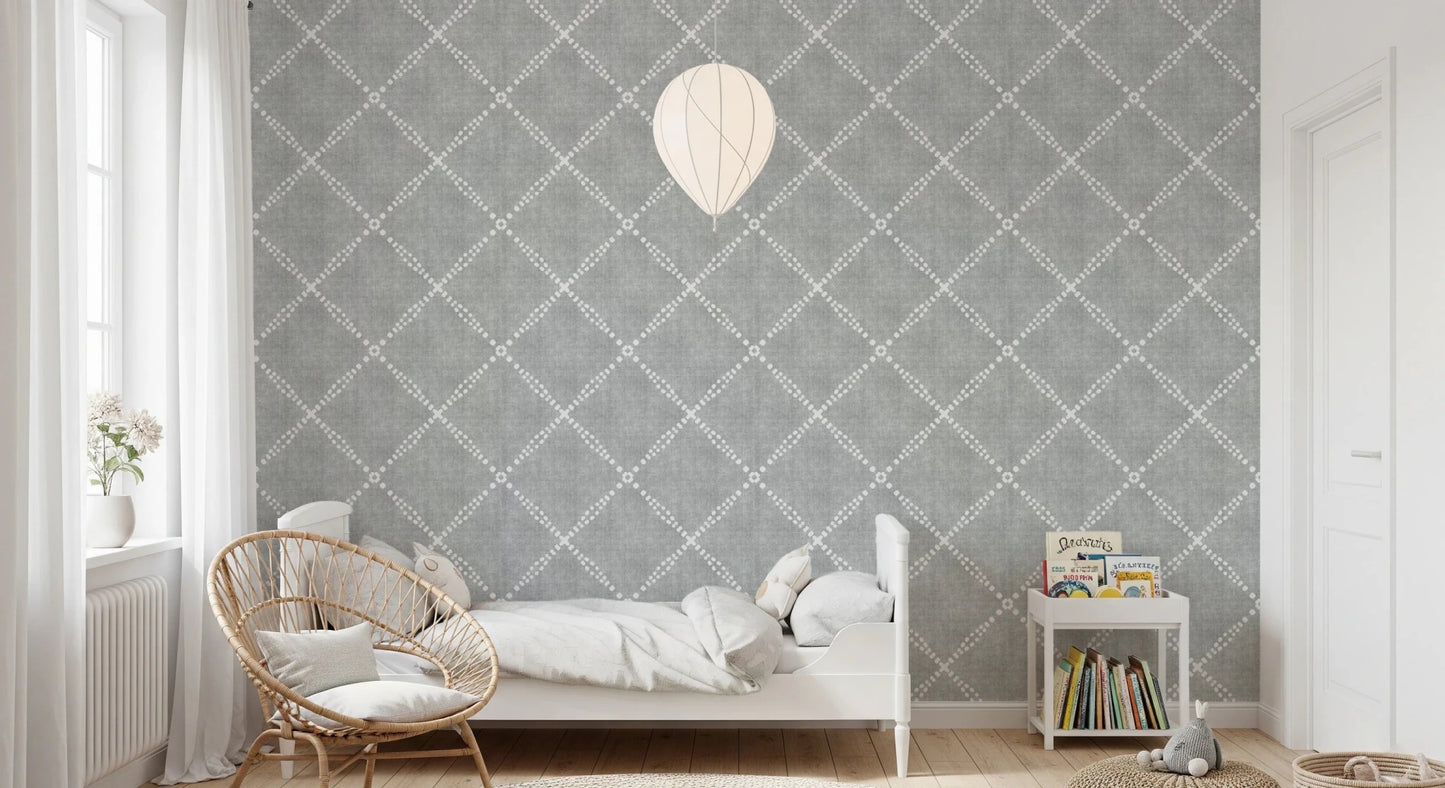 Kids bedroom corner styled using grey trellis wallpaper with soft patterned walls