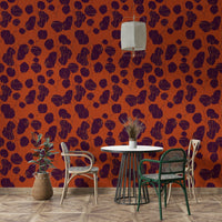 A tasteful botanical wall mural of plum leaves.

