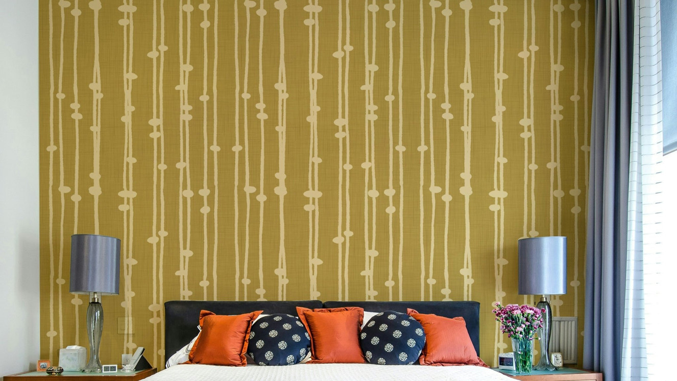 The peel and stick wallpaper on a smooth wall surface.

