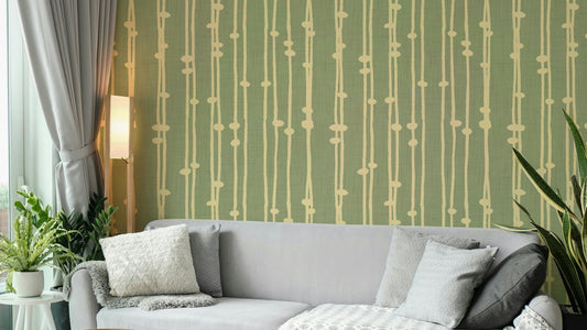 A minimalist home office with the boho striped wallpaper.