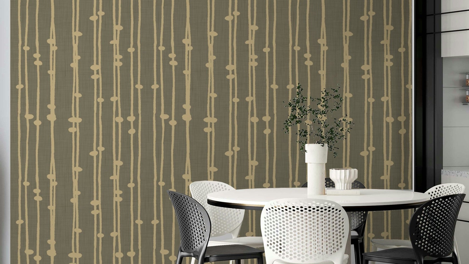 The wallpaper is used to create a feature wall in a dining room.