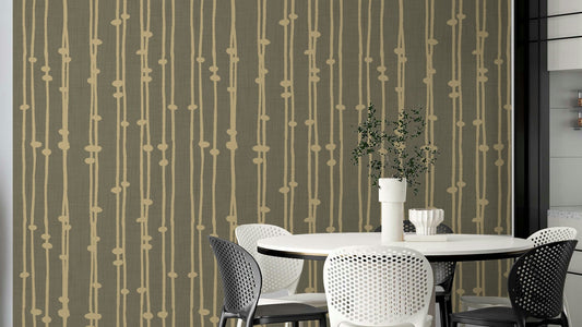 The wallpaper is used to create a feature wall in a dining room.