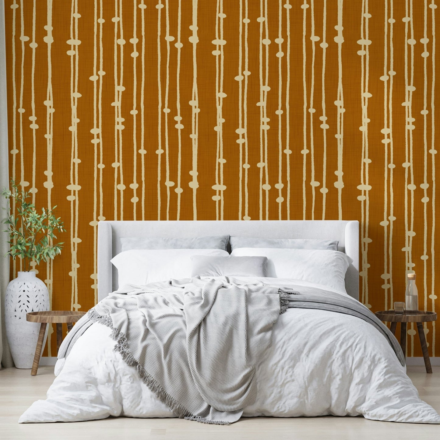 The wallpaper is used to create a feature wall in a dining room.