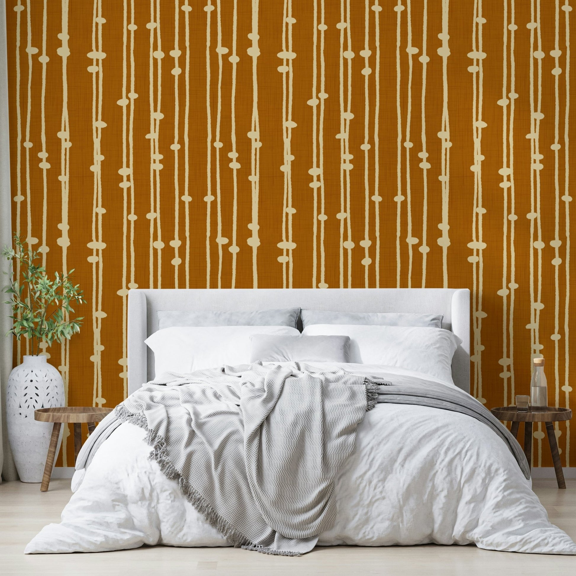 The wallpaper is used to create a feature wall in a dining room.