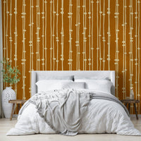 The wallpaper is used to create a feature wall in a dining room.