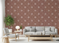 White geometric symbols on dark red wallpaper base.