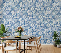 White marine sketches sit behind a Dining room with Boho Seashell Coral wallpaper.⁠GD9548