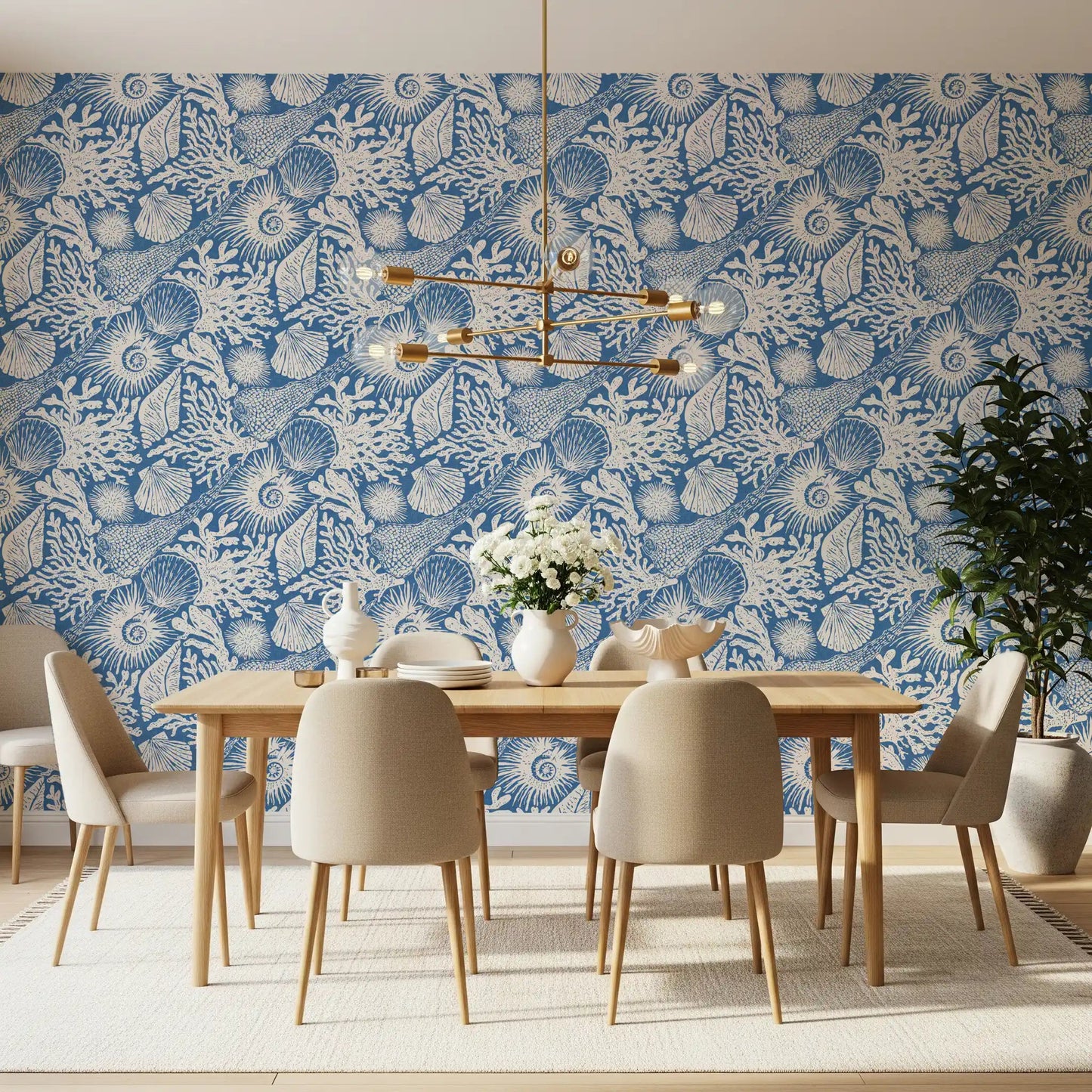 White hand-drawn motifs sit on the deep denim base of Seashell Coral wallpaper.⁠GD9548