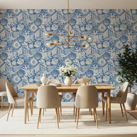 White hand-drawn motifs sit on the deep denim base of Seashell Coral wallpaper.⁠GD9548