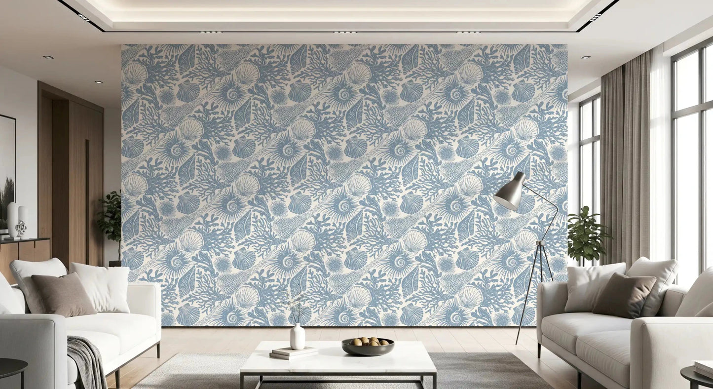Through a lounge, ammonites and urchins float across Muted Blue Seashell wallpaper.⁠GD9545