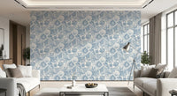 Through a lounge, ammonites and urchins float across Muted Blue Seashell wallpaper.⁠GD9545