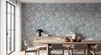 Soft azure tones wash a dining room with Seashell Coral Azure wallpaper.⁠GD9547
