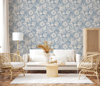 Off-white hand-drawn motifs rest on the soft azure base of Seashell Coral wallpaper.GD9547