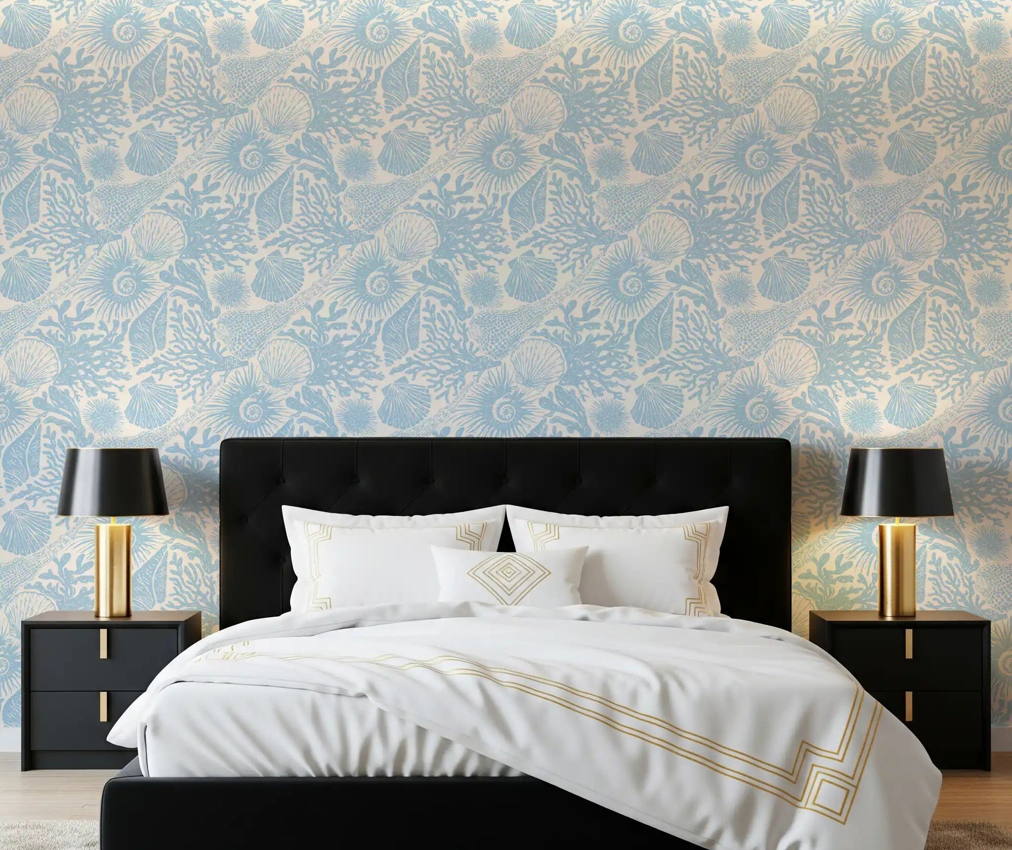 Pale blue shells wrap a bedroom behind Boho Seashell Coral wallpaper in soft tones.GD9543