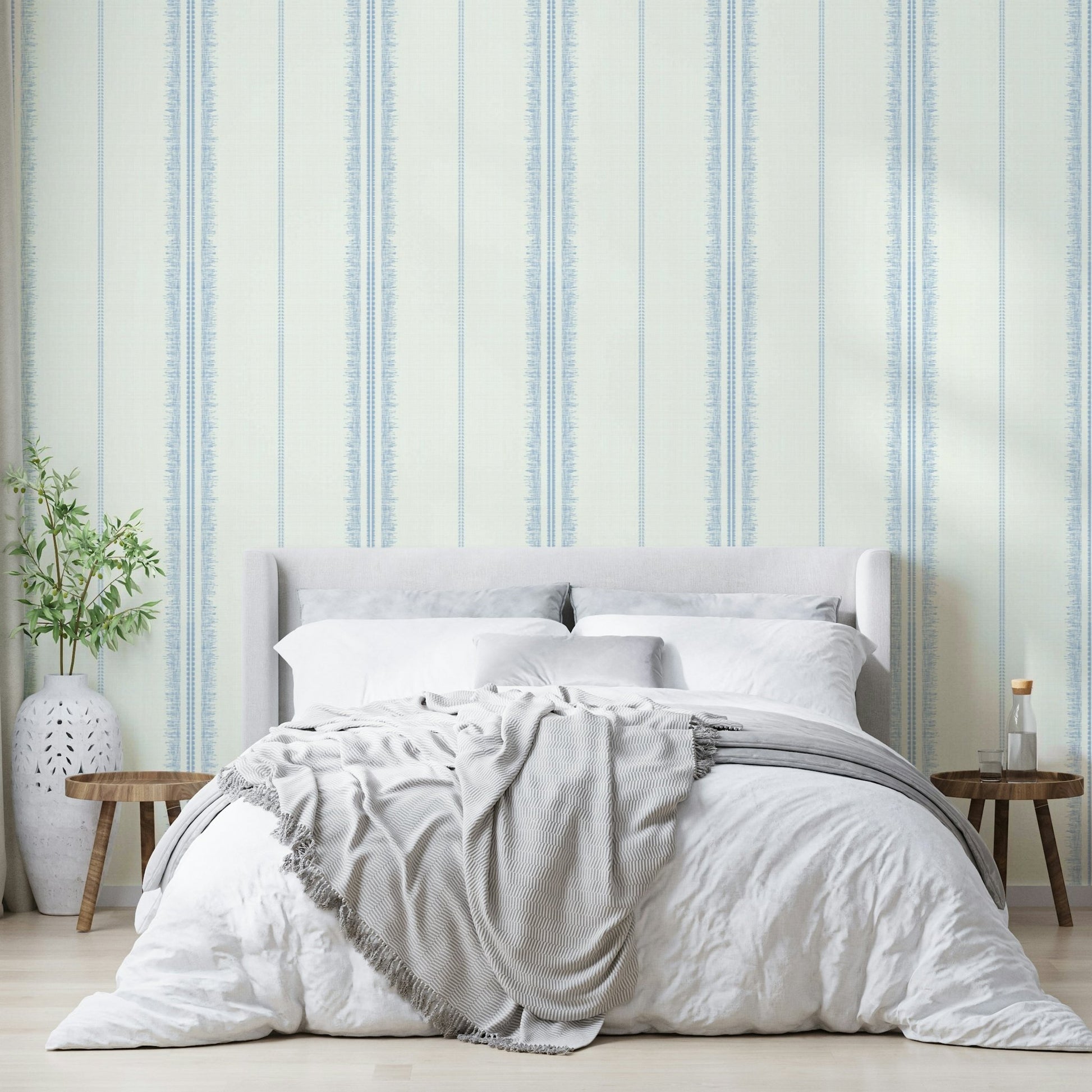 Linen-textured wallpaper with light blue boho stripes.


