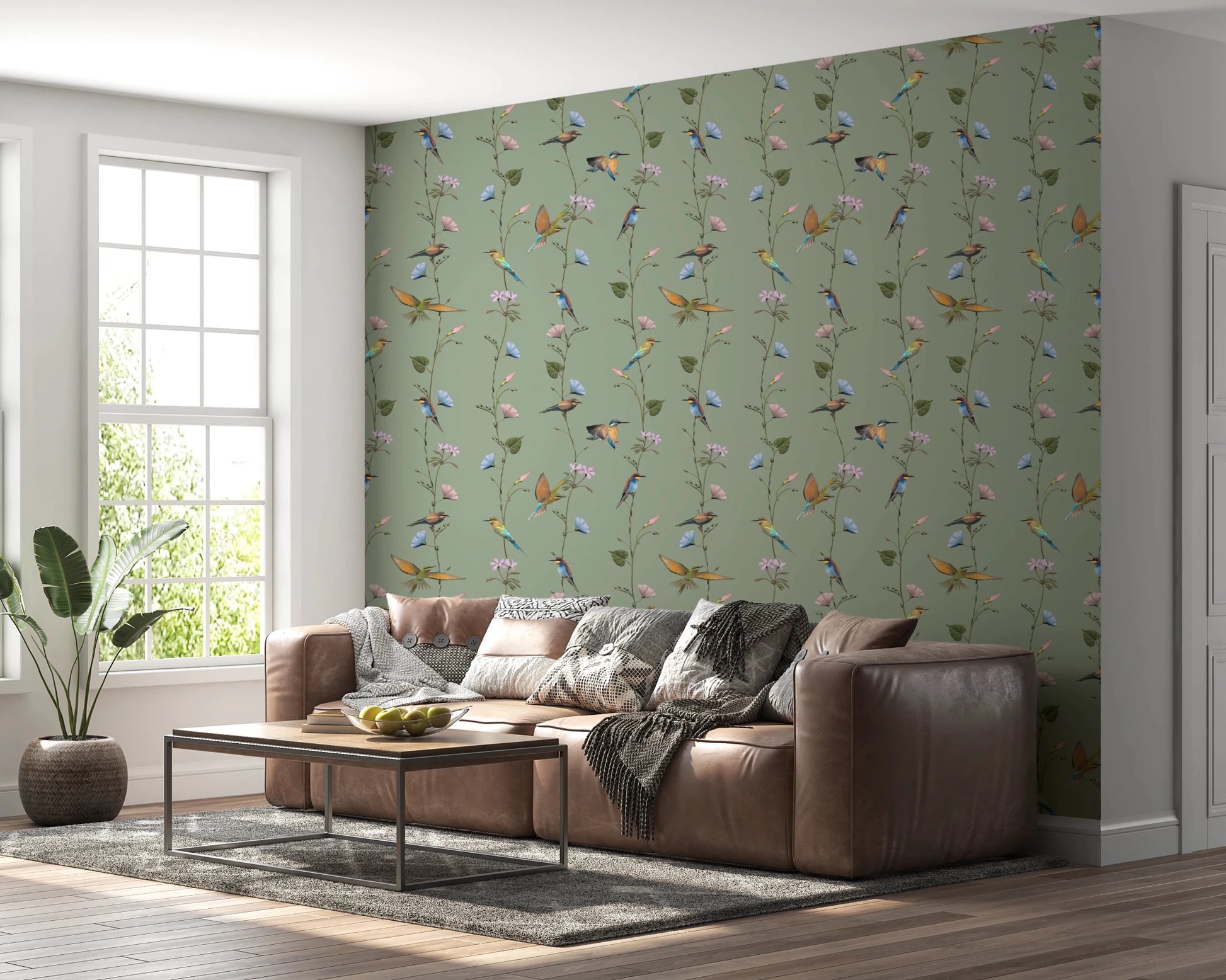 A leather sofa pairs naturally with Botanical Birds in Soft Pastels Wallpaper in this lounge
