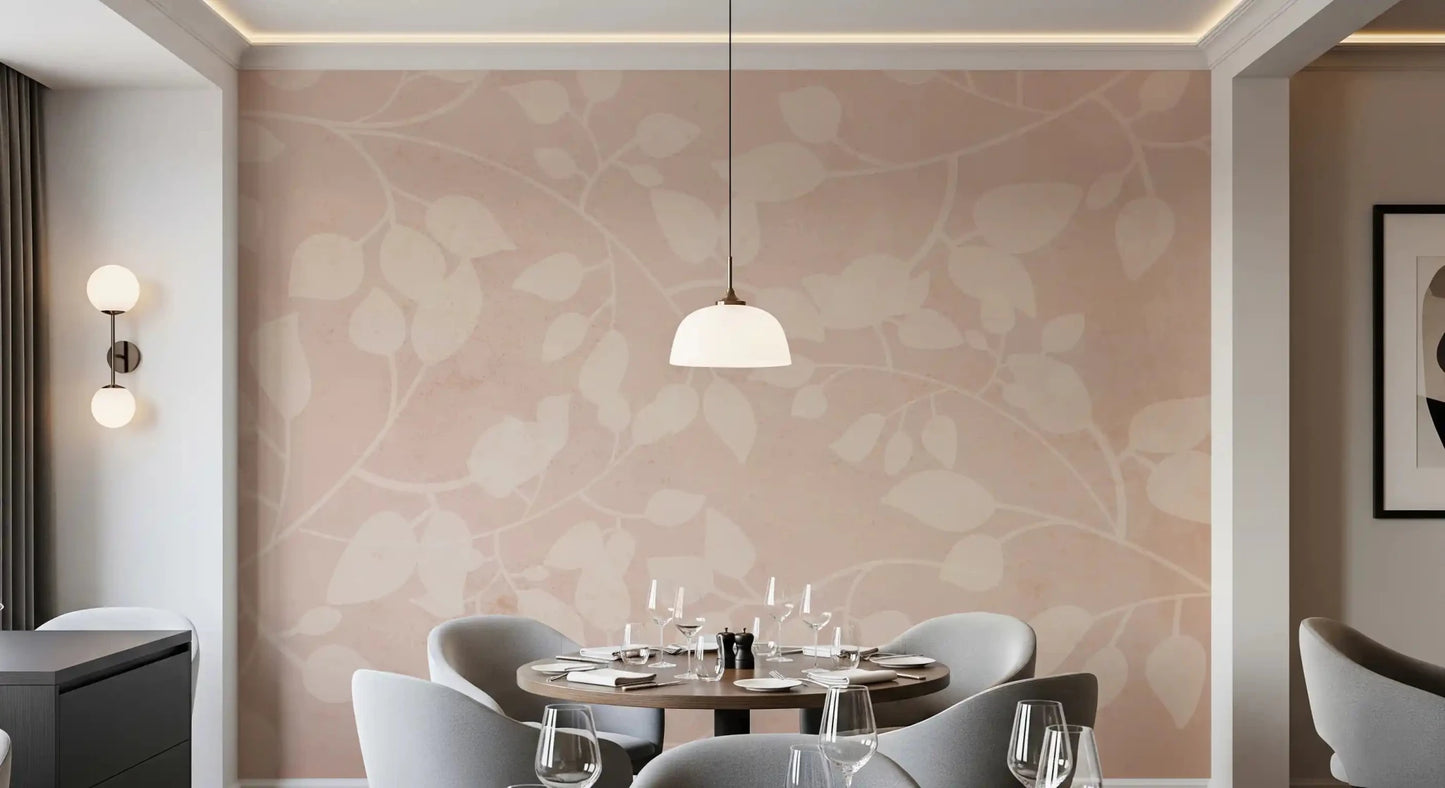 Soft botanical wall mural with cream leaves on a warm blush background