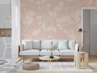 Living room with Botanical Embrace Blush wall mural in soft vine leaf pattern