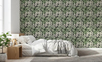 Soft bedroom view with Botanical Noir Canopy Foliage Wallpaper on the feature 