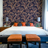 An angled shot of a wall with a botanical noir mural

