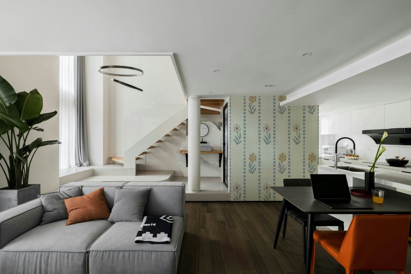 Living room accent with nature-inspired wallpaper

