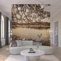 Curved lounge space styled with Branches Above Lake Wall Mural backdrop