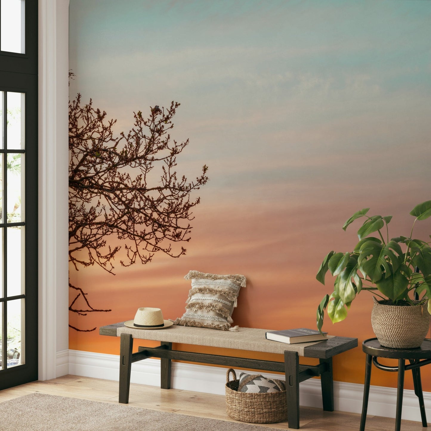 Tree limb silhouette mural in warm tones

