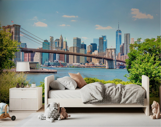 Kids bedroom with bed and toys placed before Bridge to Manhattan Wall Mural skyline
