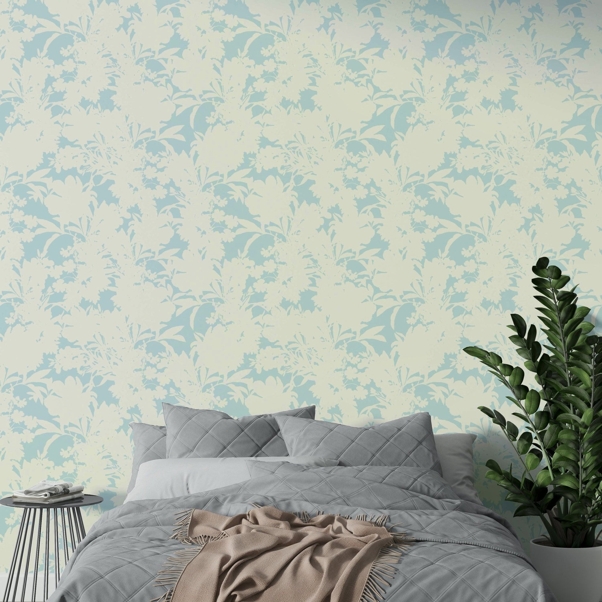 A sunroom decorated with a bright botanical mural

