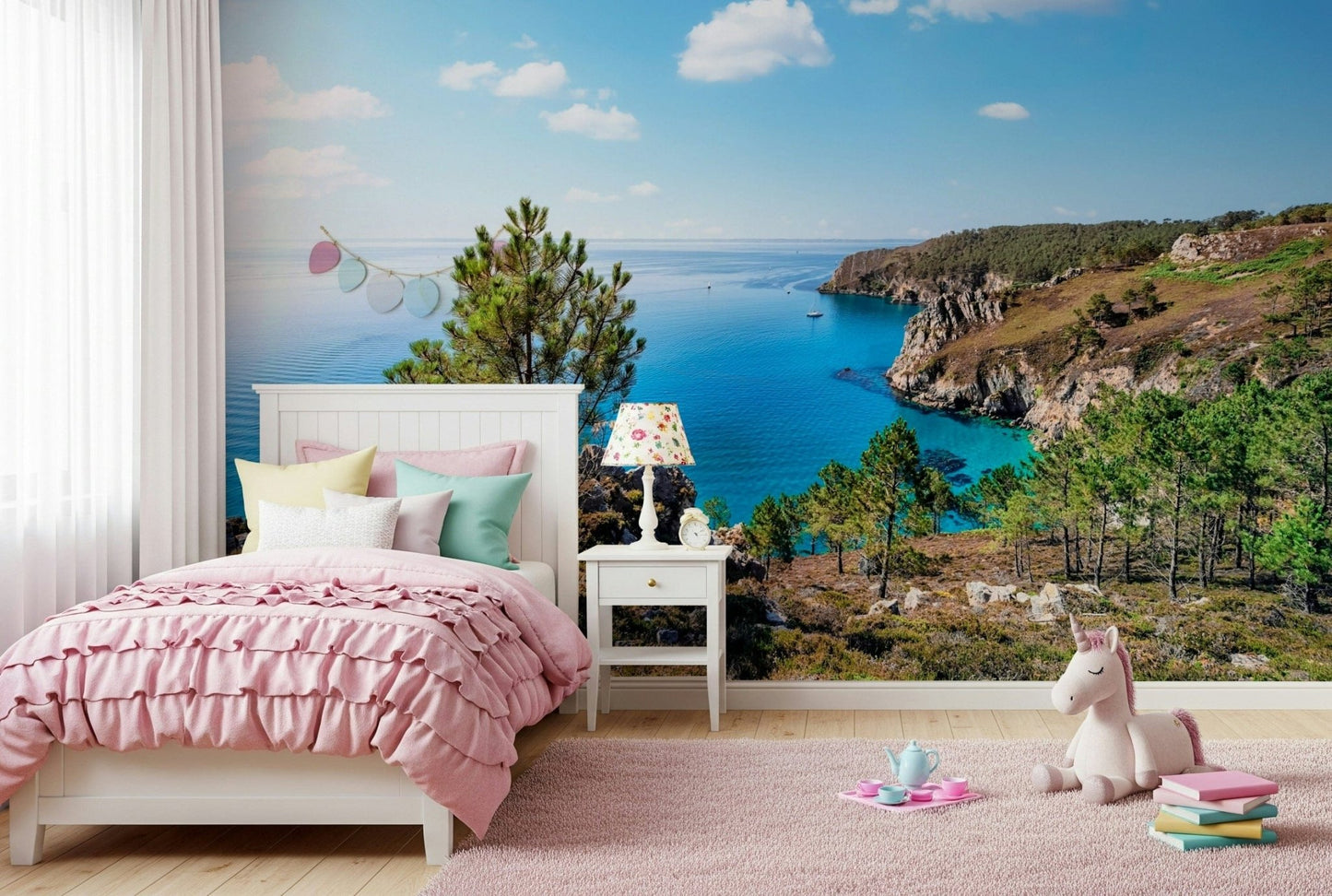 Brittany Vista Wall Mural brings bright coastal cliff views into this playful kids room