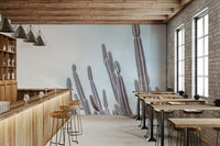 The design features various types of cacti.

