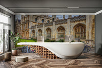 The bicycles are parked against a brick building.

