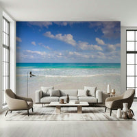 Bright living area featuring the Cancun Beach accent wall.
