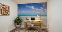 Serene coastal wallpaper for walls behind a lounge chair.