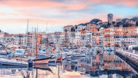 Cannes Vista Wall Mural with pastel harbor buildings and sunset marina reflections, GD7966
