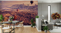 A beautiful panoramic Cappadocia wallpaper mural with floating hot air balloons.