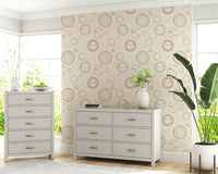 Soft pink and gold tones of the Celestial Harmony astronomical design.