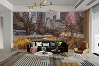 Bare trees with patches of snow on the ground.

