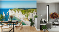 In this dining area, Chalk Cliffs Vista Wall Mural adds bright shoreline depth and light