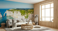 Chalk Cliffs Vista Wall Mural creates a breezy coastal setting for this warm lounge corner