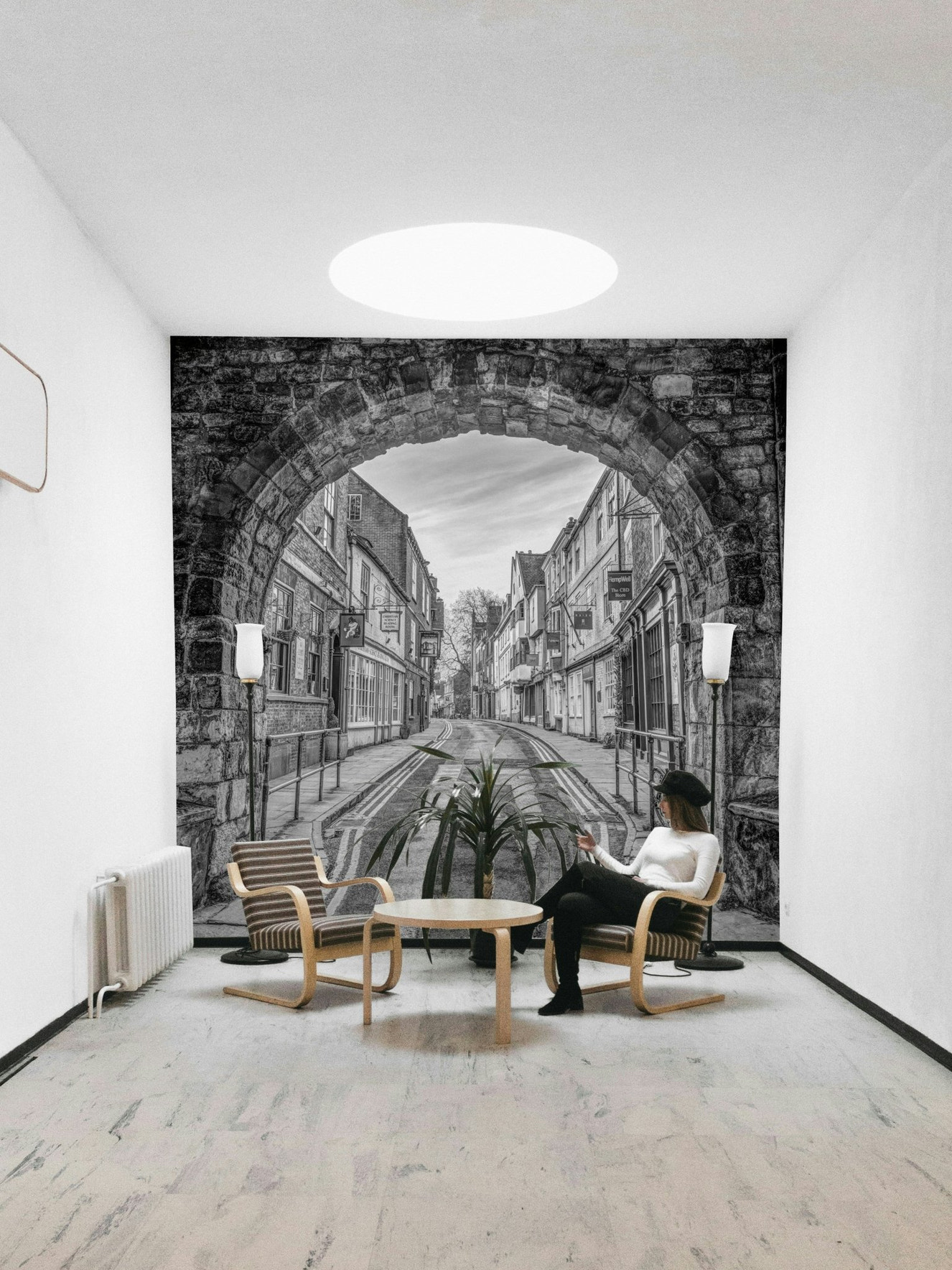 A beautiful stone archway wallpaper mural with a historic street view.

