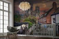A beautiful cathedral street wallpaper mural with a full moon.

