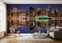 Detailed cityscape wallpaper with bright glowing office tower lights.