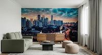Cityscape Dawn Wall Mural brings urban energy into this wide modern sitting area